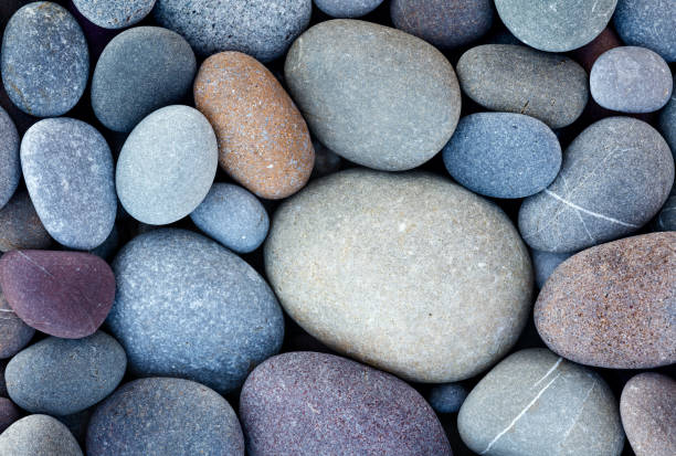 istock abstract background with round pebble stones in vintage retro stile. stones beach smooth 986119476