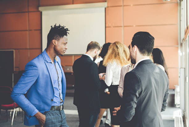 istock Business People at a Conference Meeting Standing 986154078