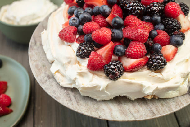 istock Pavlova Meringue Dessert Made With Berries 986154752