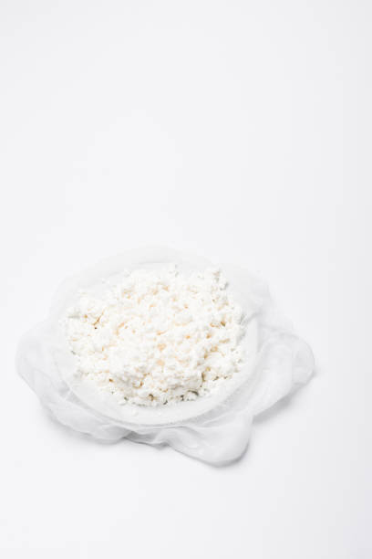 istock homemade cottage cheese on cheesecloth on white surface 986154816