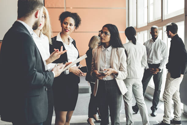 istock Business People at a Conference Meeting Standing 986157276