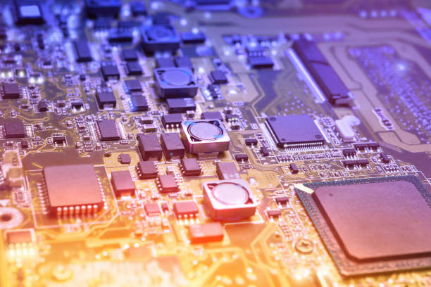 istock Closeup on electronic board in hardware repair shop, blurred and toned image 986188040