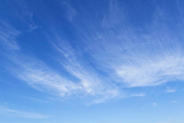 istock A beautiful summer blue sky with light feathery clouds 986192374