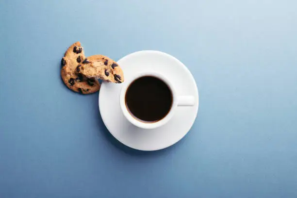 Photo of A cup of coffee and cookies.