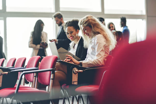 istock Business Woman at a Conference Meeting Working With Computer 986196372