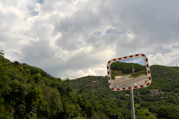 istock Road mirror - security on the winding mountain roads 986197318