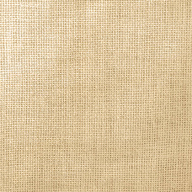 istock Hessian sackcloth woven texture pattern background in light yellow gold brown color tone 986207708