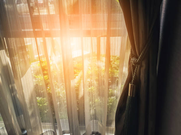 istock Brown Curtain with Beautiful Sun Light and Shadow 986207934