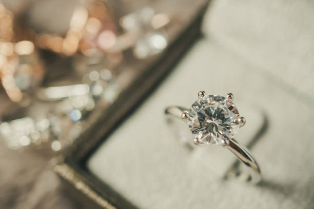istock luxury engagement Diamond ring in jewelry gift box 986207994