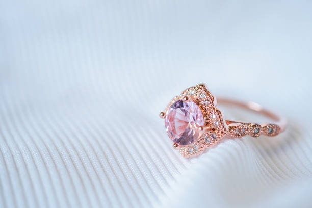 istock Jewelry luxury pink gold sapphire gemstone ring background 986219764