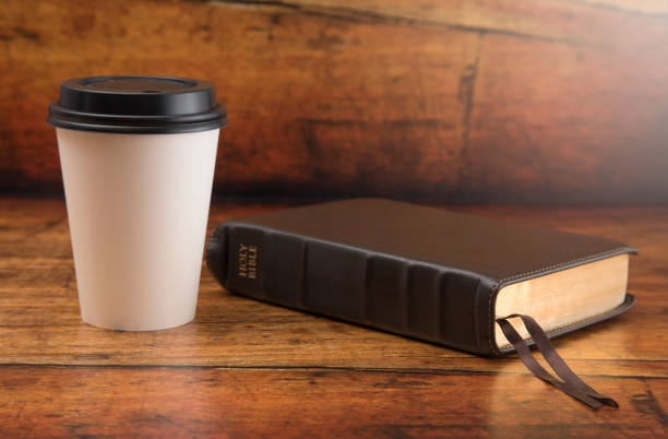 istock Bible and a Cup of Coffee in a Disposable Paper Cup 986227908