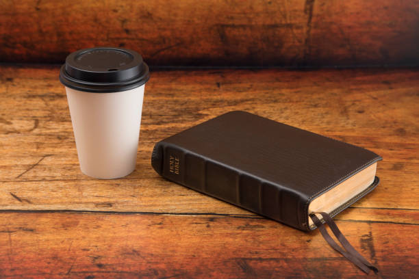istock Bible and a Cup of Coffee in a Disposable Paper Cup 986227916