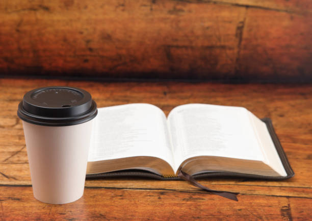 istock Bible and a Cup of Coffee in a Disposable Paper Cup 986228128
