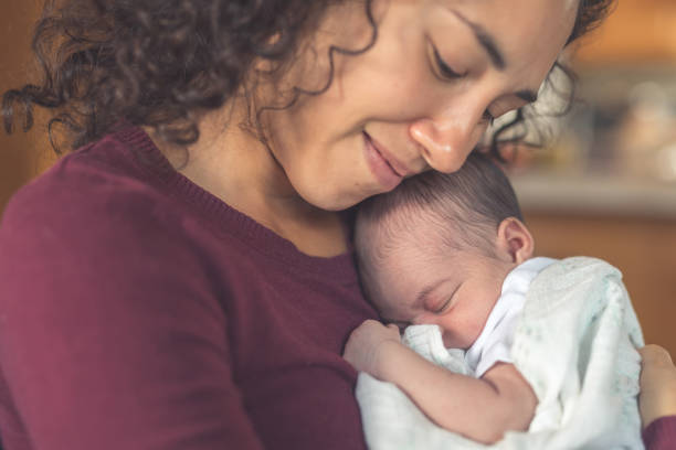 istock New mom holds her infant daughter 986262822