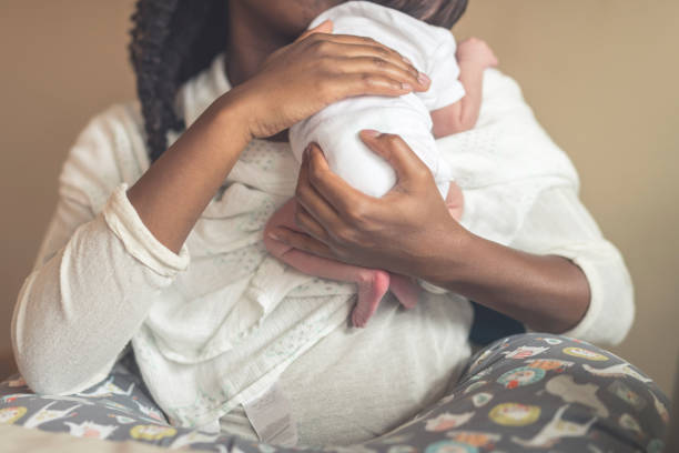 istock New mom holds her infant daughter 986262828