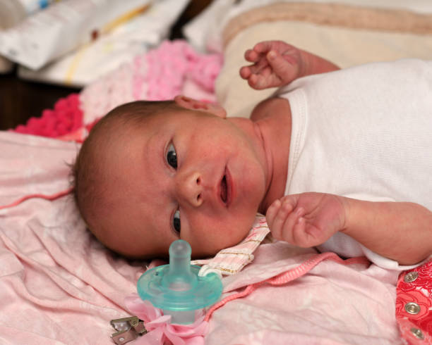 istock Newborn Baby Girl Getting Her Diaper Changed 986274646