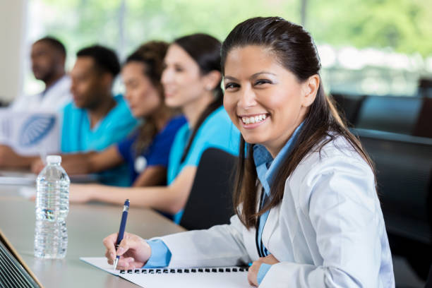 istock Happy physician attends healthcare seminar 986274840
