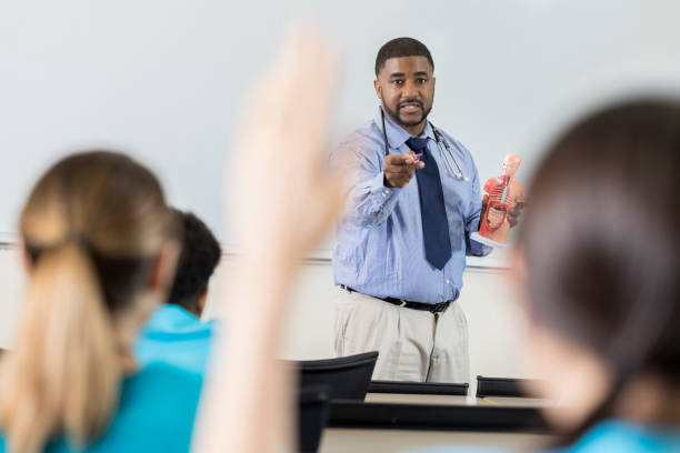 istock Medical school professor calls on student to answer question 986274882