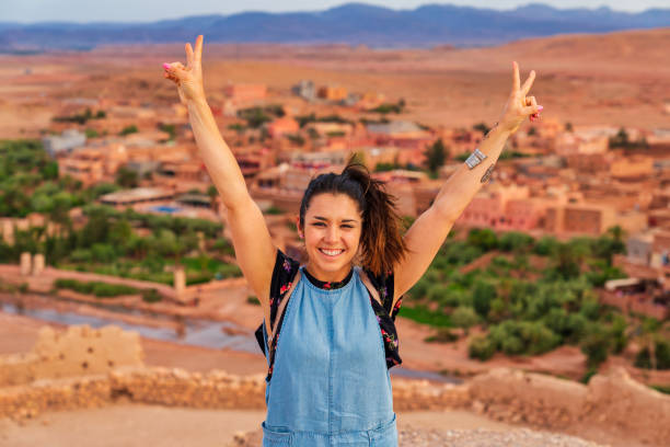 Young tourist visiting Ait Benhaddou - Ancient city in Morocco North Africa Young tourist visiting Ait Benhaddou - Ancient city in Morocco North Africa ait benhaddou stock pictures, royalty-free photos & images