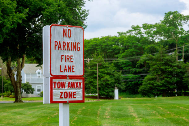 Fire lane no parking sign Red Letters on White Sign