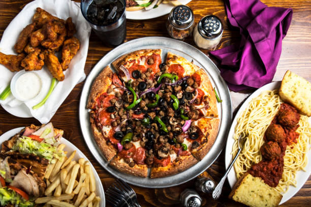 istock Hero Shot Italian Pizza Spaghetti Chicken Wings 986311800