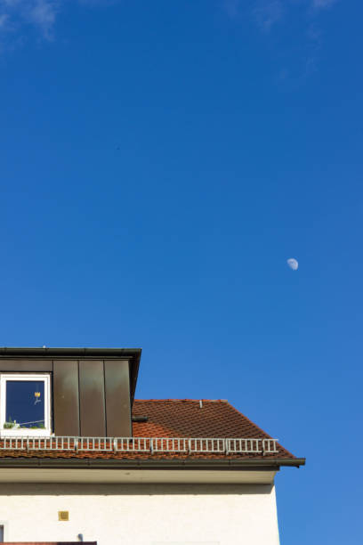 istock blue sky city facades and rooftops 986353190
