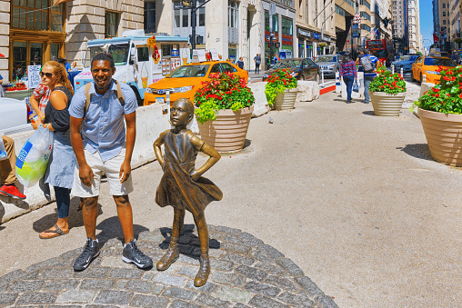 New York, USA- August 14, 2017 :  Statue of Fearless Girl on Broadway street. Financial capital of America is New York City.