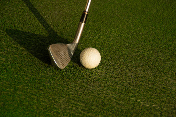 istock Club about to hit a golf ball 986387878
