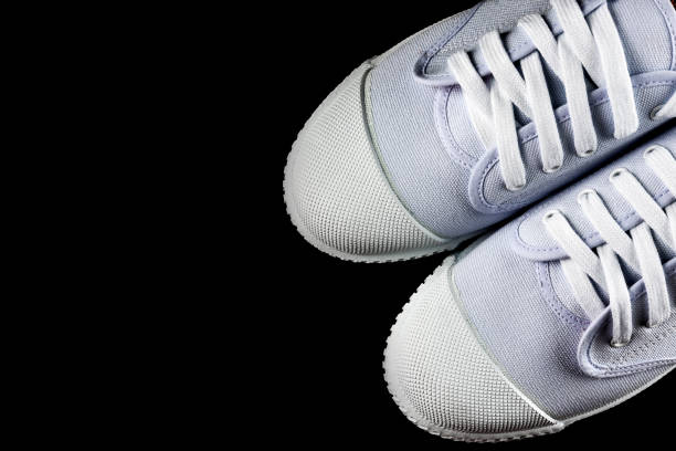 istock Top View White Sneakers isolated on black background 986414830