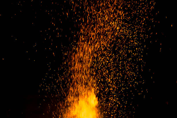 istock bonfire spark in the dark sky in night, shallow focus 986423516