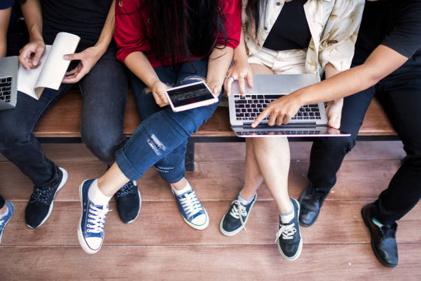 istock young people being used computer and tablet. education and technology concept. 986437130