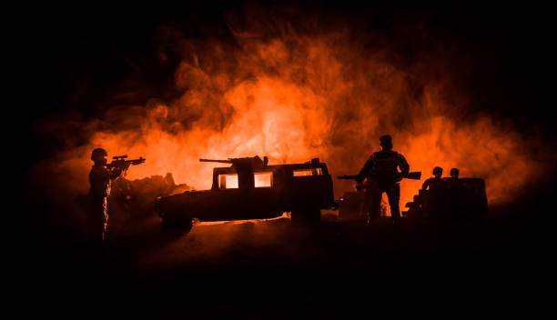 war concept. military silhouettes fighting scene on war fog sky background, world war soldiers silhouettes below cloudy skyline at night. attack scene. army jeep vehicles with soldiers. army jeep - car individuality military 4x4 imagens e fotografias de stock