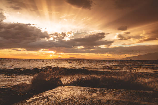 Sunset on the beach with crushing tidal waves