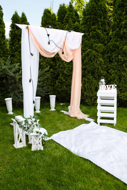 istock Wedding arch outdoors. Beautiful wedding set up. 986455474