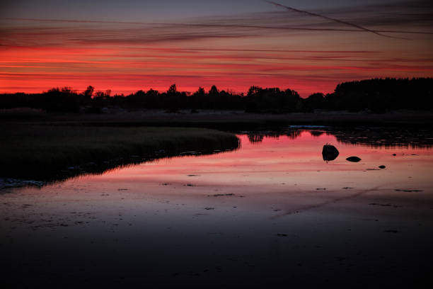 istock Colorful reflections in the water after sunset 986455956