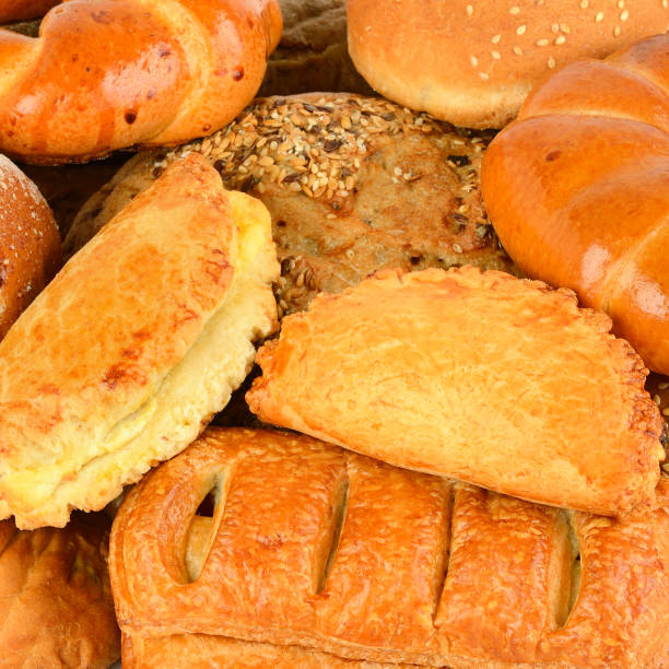 istock Background from the assortment of bread and appetizing baking. 986460176