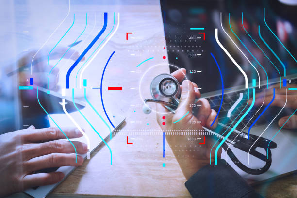 istock Medical technology network team concept. Doctor hand working with smart phone modern digital tablet and laptop computer with graphics  chart interface, Sun flare effect photo 986463940