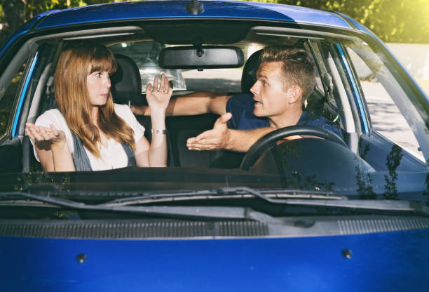 istock Young couple in car have a fierce argument 986463980