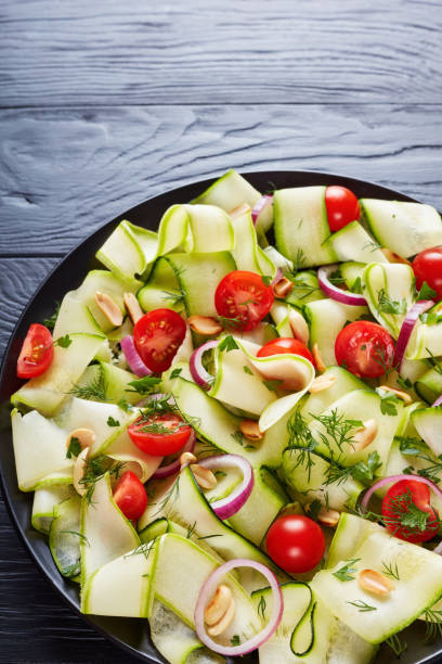 istock summer zucchini ribbon salad , top view 986464104
