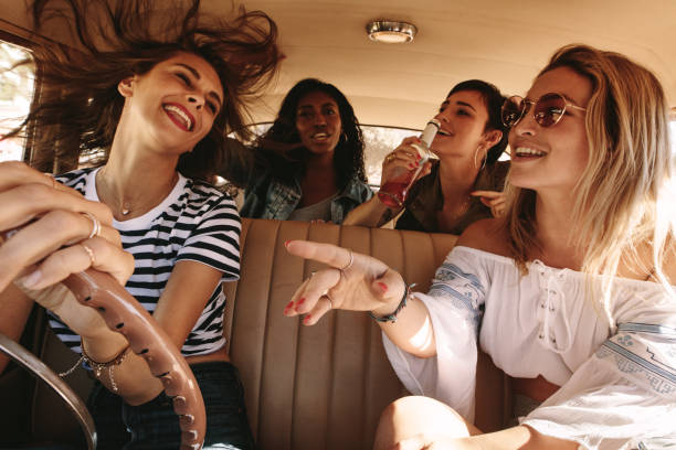 istock Girls having fun on road trip 986466438