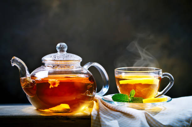 istock Cup of freshly brewed black tea,warm soft light, darker background 986475260