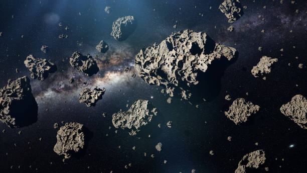 a group of asteroids in front of the galaxy a group of asteroids in front of the Milky Way galaxy asteroid stock pictures, royalty-free photos & images