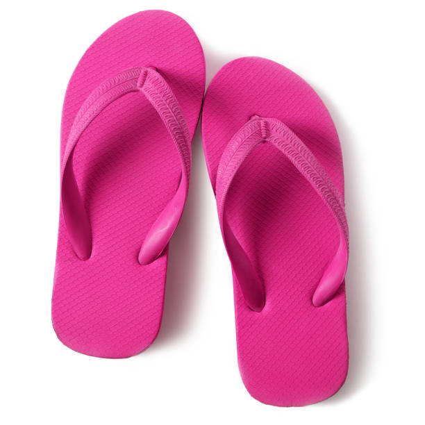 istock Pink flip flop sandals isolated on white background 986497182