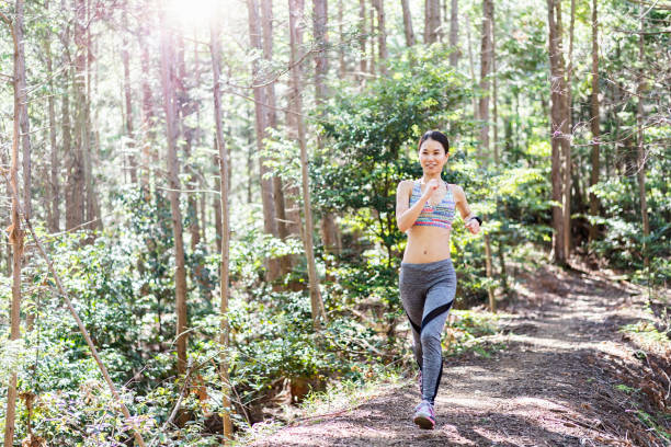 istock Woman training with trail running 986501260