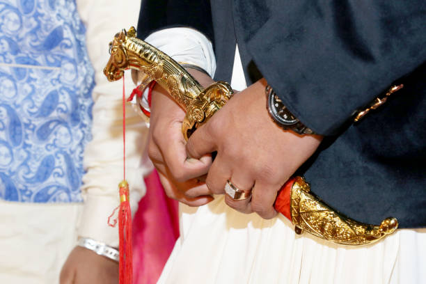istock indian groom Hold a Traditional Knife in wedding 986501762