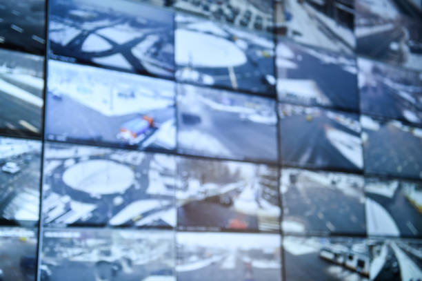 istock Detail shot with security surveillance monitors command center 986504624