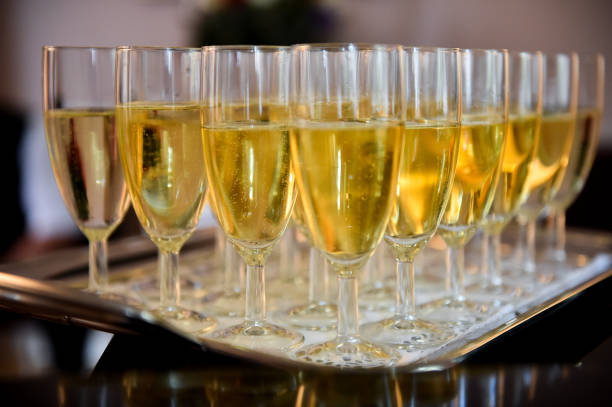 Champagne glasses on a tray at a reception