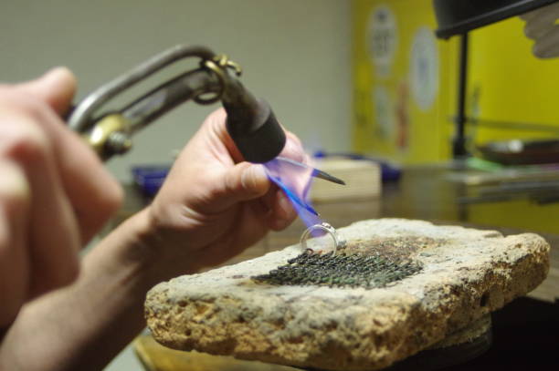 istock Jeweler working on ring, closeup 986504652