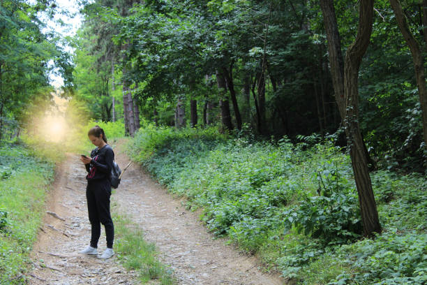 istock Young women in forest. 986508984