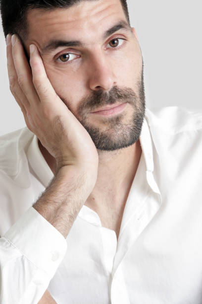 istock Portrait of young attractive bearded man, studio headshot 986513776